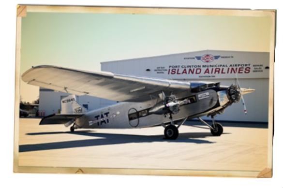 island airlines ford trimotor sits on the airport apron